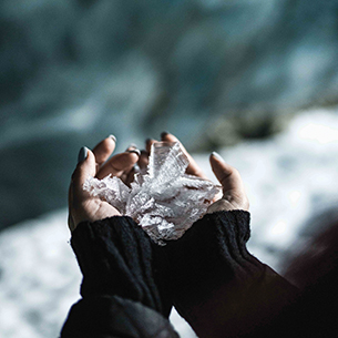 Person holding large ice crystal formations 